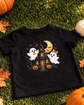 Black kids Halloween t-shirt with two friendly ghosts in front of a haunted house under the moon