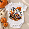 White baby bodysuit with a ghost in an orange beanie holding a candy bucket and the text My 1st Halloween 2026