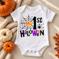 White baby bodysuit with colorful My 1st Halloween lettering and a spider web